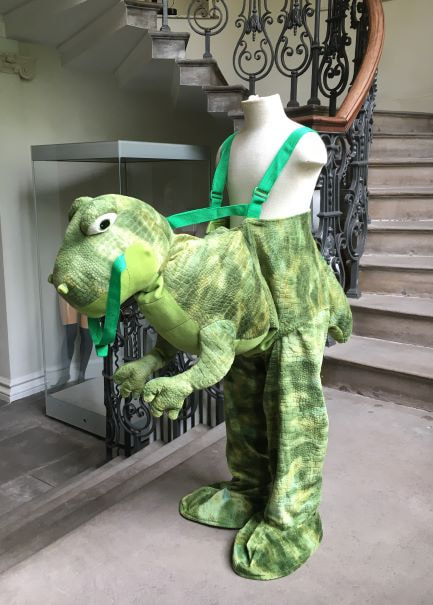 Mannequin dressed in a dinosaur costume