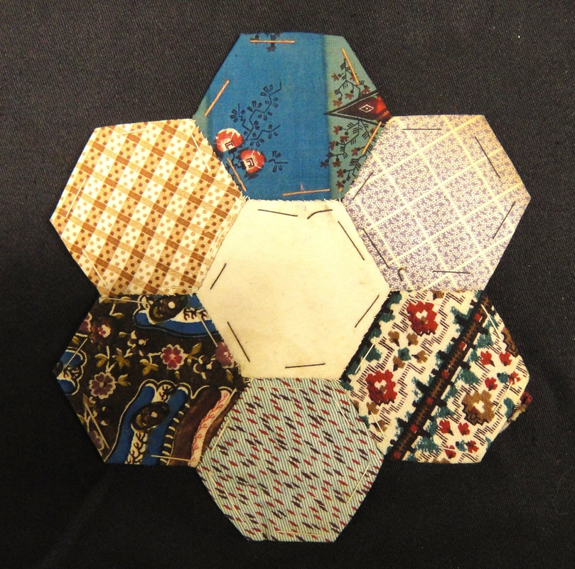 Patchwork piece, printed cotton and paper, 19th century.