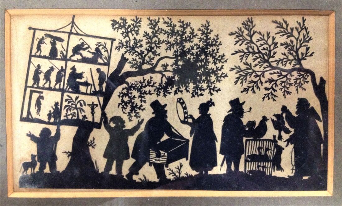 Silhouette made of cut black paper, showing six people in a procession beneath leafy trees