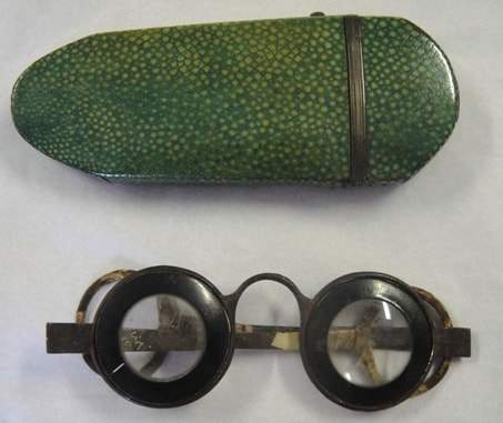 Pair of horn-rimmed and metal spectacles with green shagreen case