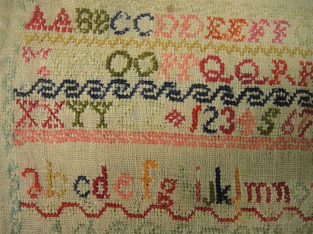 Detail of stitching on linen sampler, probably embroidered by Mary Ann Elizabeth Saunders, 1840-1850.