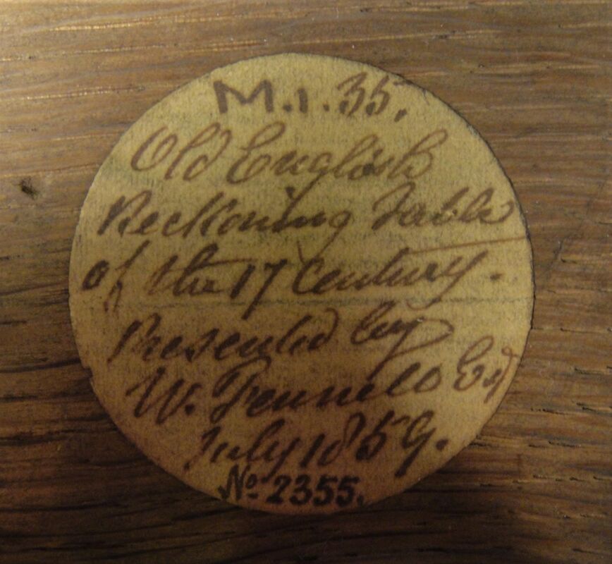 Handwritten collector's label inside set of Napier's Bones or reckoning tables.