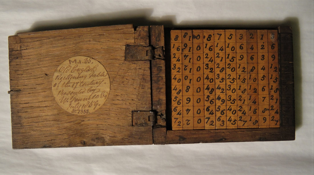 Set of Napier's Bones or reckoning tables, in oak case, lid open.