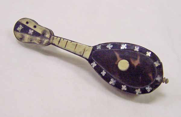 Miniature mandolin made of shell and wood  