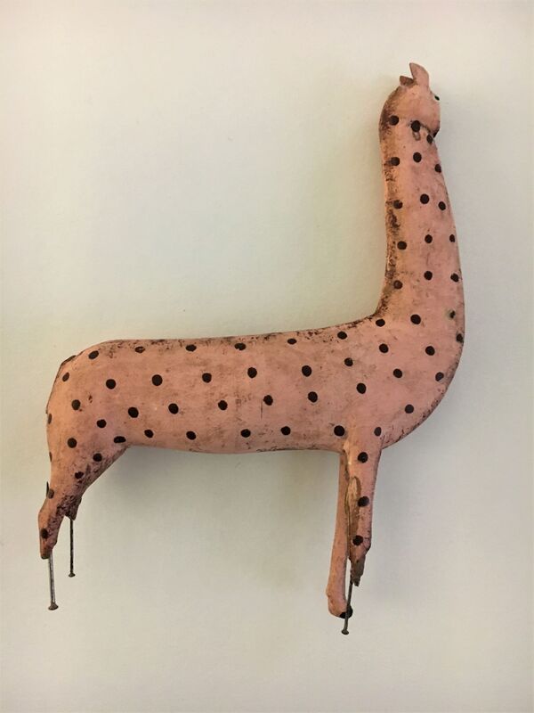 Pink llama from a set of wooden Noah's ark animals, damaged with dressmaker's pins for legs.